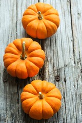 Autumn background with pumpkins with copy space, selective focus