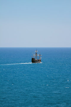 Two-mast sailing motorized vessel going to sea