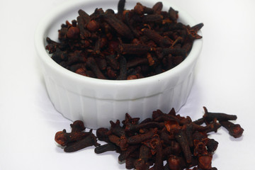 dry cloves on white background