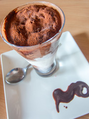 refreshing frappe on a decorated plate and cocoa powder sprinkled 