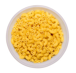 dry macaroni in white bowl isolated on white