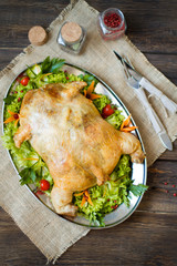 Сhicken roasted stuffed small turkey and vegetables