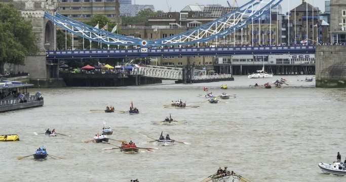 Time lapse view of hundreds of rowing boats on the river Thames at Tower bridge in London