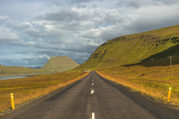 Isolated road and Icelandic colorful landscape at Iceland, summe
