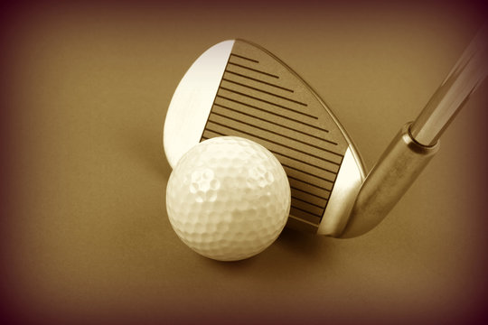 Golf club and ball sepia style image 