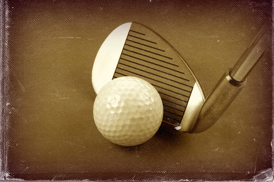 Golf club and ball sepia style image and worn photo paper effect.