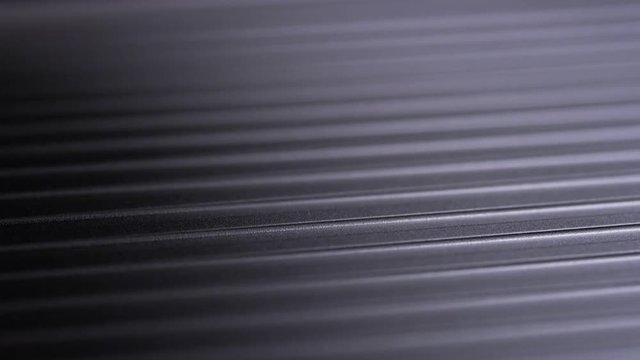 Light Shines Over Grooved Metal Texture, Macro