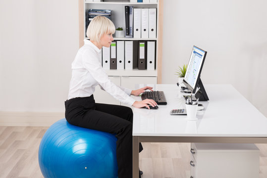 Businesswoman Looking At Gantt Chart On Computer