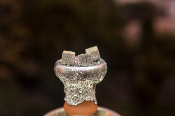 Preparing hookah at a restaurant