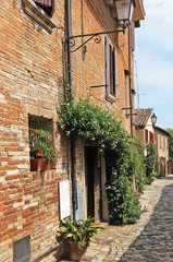 Fototapeta na wymiar Narrow street in old town in Italy