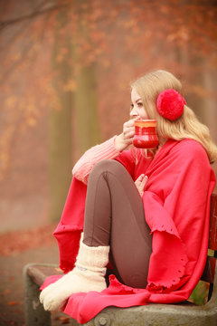 Girl with cup in park.