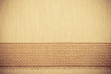 Jute ribbon on linen cloth background