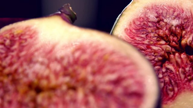 Cut ripe figs 4K close up pan shot