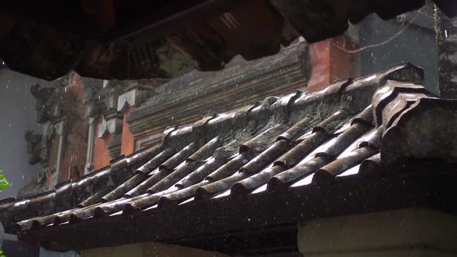 Raindrops Breaking on a Clay Tile Roof. Slow Motion