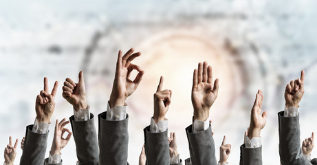 Fototapeta premium Group of people with raised hands . Mixed media