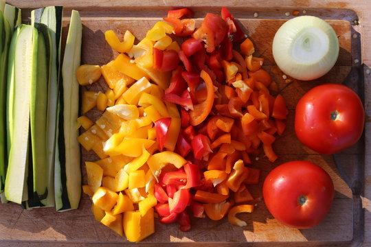 Fresh vegetables from the garden on a wooden board and viewed from above