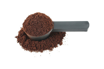 measuring coffee spoon with coffee powder isolated on white