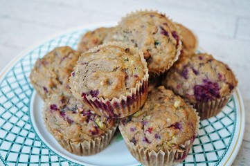 Homemade vegan muffins with zucchini and raspberries