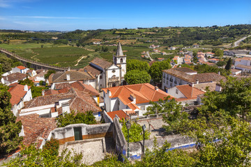 Obraz premium Santa Maria Church Castle Walls Countrside Obidos Portugal