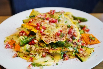 Zucchini, yellow squash and pomegranate summer salad