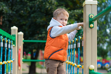 Obraz premium Little boy on the playground