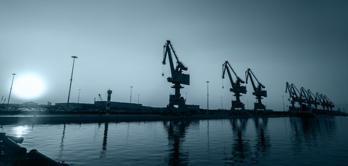 In the evening, gantry crane at the dock