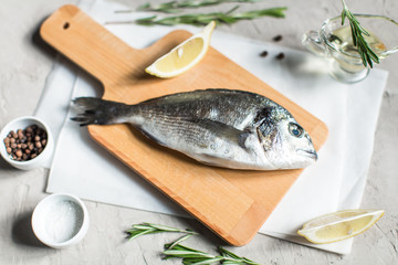 Fresh dorado fish with herbs and pepper