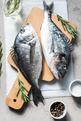 Fresh dorado fish with herbs and pepper