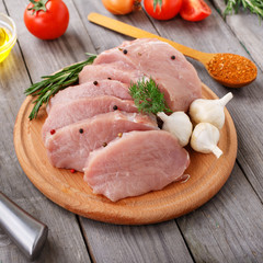 Pieces of fresh pork on a wooden board