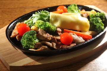 hot pan with pork and cheese