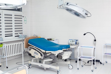 Medical bed in labour room at modern hospital