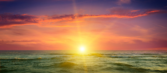Fototapeta na wymiar ocean, cloudy sky and a fantastic sunset
