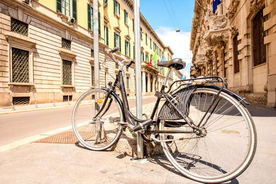 Bicycle on the street in the old city center of Milan in Italy
