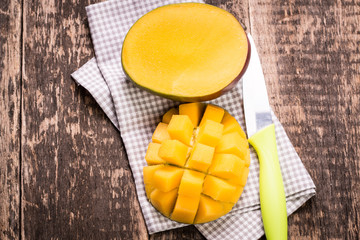 Fresh rip mango on a wooden background.Healthy food