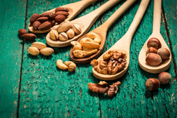 Mix nuts on wooden table,healthy vegan food.