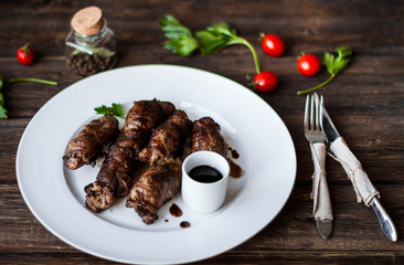 beef stuffed with mushrooms in a bowl on a wooden table