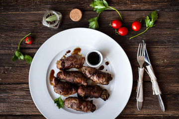 beef stuffed with mushrooms in a bowl on a wooden table