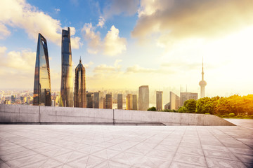 Fototapeta na wymiar cityscape and skyline of shanghai from empty brick floor