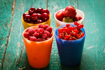 Fresh summer berries , wooden background, healthy food.
