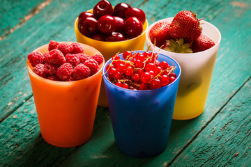Fresh summer berries , wooden background, healthy food.