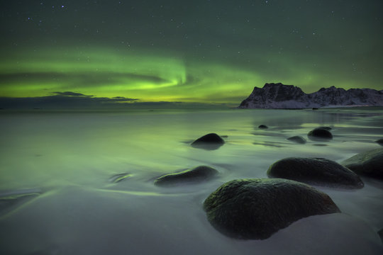 Aurora borealis over a beach on the Lofoten in Norway