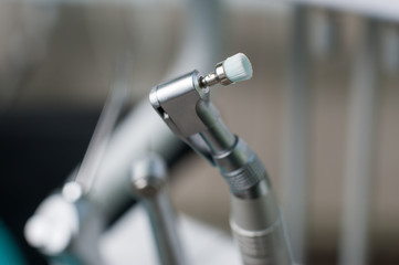 Close-up of dental drill bit with head for polishing and brushing teeth. Dentistry