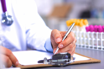 Fototapeta premium doctor at his desk working with medical equipment in the background