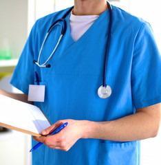 Closeup portrait of a doctor with stethoscope holding folder