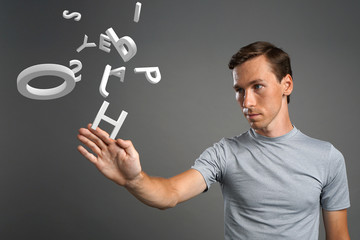 Man working with a set of letters, writing concept.