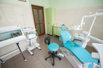 Dental unit, therapeutic and surgical instruments in empty dentist office. Surgery. Dentistry.