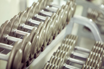 Closeup of dumbbells in fitness club
