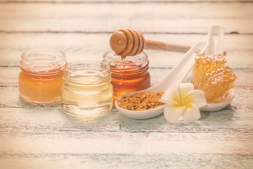 healthy honey composition, wooden background, vintage filters