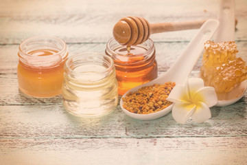 healthy honey composition, wooden background, vintage filters
