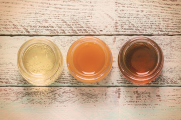 healthy honey composition, wooden background, vintage filters